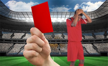 simsearch:400-07665266,k - Composite image of hand holding up red card to player against stadium full of argentina football fans Stock Photo - Budget Royalty-Free & Subscription, Code: 400-07665375