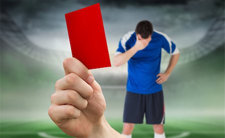 simsearch:400-07665266,k - Composite image of hand holding up red card to player against football pitch in large stadium Stock Photo - Budget Royalty-Free & Subscription, Code: 400-07665370