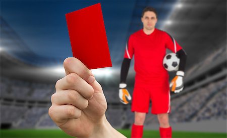 soccer goalie hands - Composite image of hand holding up red card to goalie against football stadium Stock Photo - Budget Royalty-Free & Subscription, Code: 400-07665373