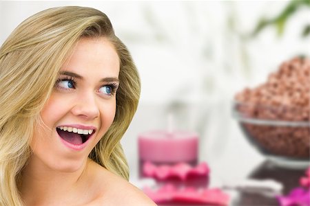 simsearch:649-07648347,k - Smiling blonde natural beauty against three pink aromatherapy candles Foto de stock - Super Valor sin royalties y Suscripción, Código: 400-07665398