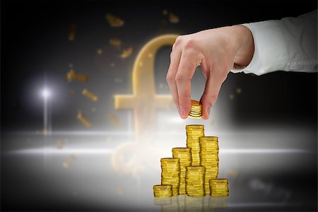 piles of cash pounds - Businessman holding coins against golden pound sign Stock Photo - Budget Royalty-Free & Subscription, Code: 400-07665635