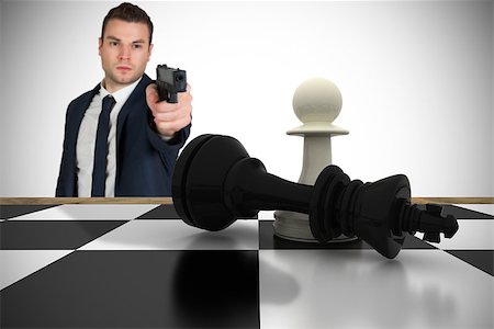 simsearch:400-07665425,k - Composite image of serious businessman pointing a gun at chess piece against white background with vignette Stockbilder - Microstock & Abonnement, Bildnummer: 400-07665708