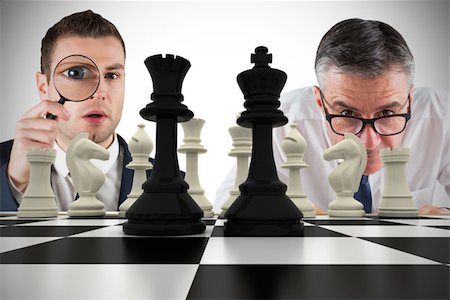 simsearch:400-07665425,k - Composite image of business people with chessboard against white background with vignette Stockbilder - Microstock & Abonnement, Bildnummer: 400-07665715