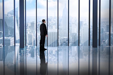 Composite image of businessman standing in room overlooking city Stock Photo - Budget Royalty-Free & Subscription, Code: 400-07665733