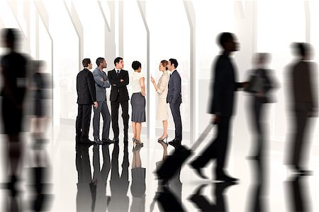 simsearch:400-07665756,k - Business colleagues looking against room with large window looking on city Stock Photo - Budget Royalty-Free & Subscription, Code: 400-07665756