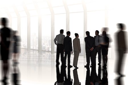 simsearch:400-07665756,k - Composite image of business colleagues standing against room with large window looking on city Stock Photo - Budget Royalty-Free & Subscription, Code: 400-07665771