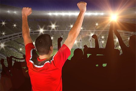 simsearch:400-07665266,k - Excited football player cheering against large football stadium with lights Stock Photo - Budget Royalty-Free & Subscription, Code: 400-07665817