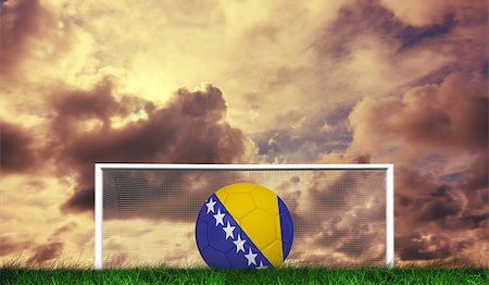 Football in bosnia and herzegovina colours  against green grass under cloudy sky Stock Photo - Budget Royalty-Free & Subscription, Code: 400-07665851