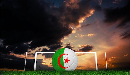 Football in algeria colours against green grass under dark blue and orange sky Stock Photo - Budget Royalty-Free & Subscription, Code: 400-07665853