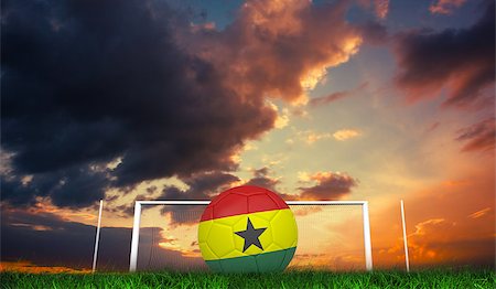 Football in ghana colours against green grass under dark blue and orange sky Stock Photo - Budget Royalty-Free & Subscription, Code: 400-07665869