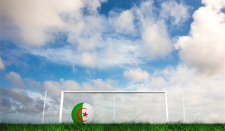 Football in algeria colours against green grass under dark blue and orange sky Stock Photo - Budget Royalty-Free & Subscription, Code: 400-07665884