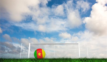 Football in cameroon colours against green grass under dark blue and orange sky Stock Photo - Budget Royalty-Free & Subscription, Code: 400-07665882