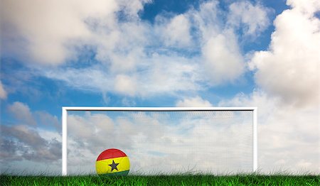 Football in ghana colours against green grass under dark blue and orange sky Stock Photo - Budget Royalty-Free & Subscription, Code: 400-07665895