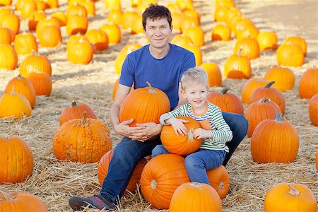 simsearch:400-07916492,k - happy family having fun at pumpkin patch at fall Stock Photo - Budget Royalty-Free & Subscription, Code: 400-07666674
