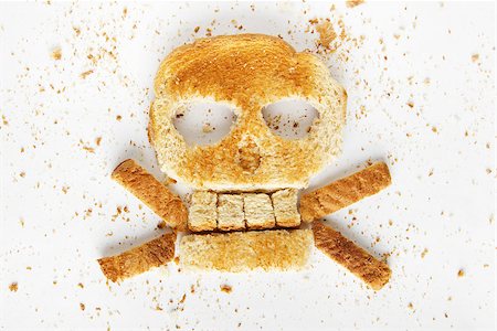 diabetic food - Stock image image of bread skull and crossbones with crumbs on white background Stock Photo - Budget Royalty-Free & Subscription, Code: 400-07666857