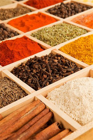 simsearch:400-06365740,k - Wooden box with different herbs and spices - pepper, paprika, cumin and others. Stockbilder - Microstock & Abonnement, Bildnummer: 400-07667155