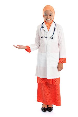 simsearch:400-06142860,k - Full body young Muslim female doctor portrait, showing welcome hand sign standing isolated on white background. Fotografie stock - Microstock e Abbonamento, Codice: 400-07667631