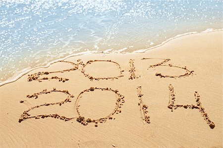 digits  2013 and 2014 on the sand seashore - concept of new year and passing of time Stock Photo - Budget Royalty-Free & Subscription, Code: 400-07667700