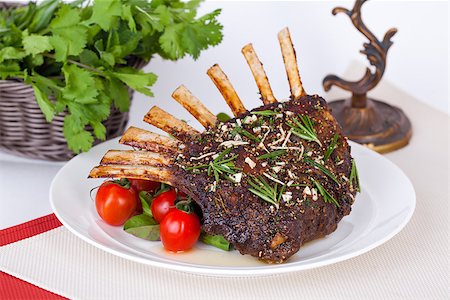 restaurant steak - rack of lamb with tomatoes on the table still life Stock Photo - Budget Royalty-Free & Subscription, Code: 400-07668097