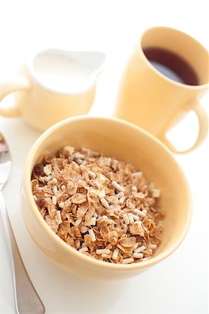 stockarch (artist) - High key image of a healthy wholesome breakfast with a bowl of muesli with a jug of milk and mug of freshly brewed filter coffee Foto de stock - Royalty-Free Super Valor e Assinatura, Número: 400-07668487