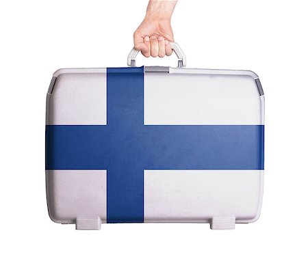 Used plastic suitcase with stains and scratches, printed with flag, Finland Stock Photo - Budget Royalty-Free & Subscription, Code: 400-07668883