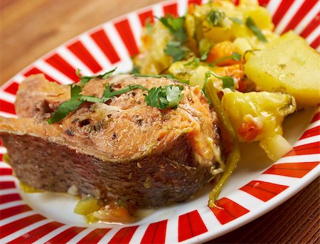 roasted fish - Baked trout with potatoes .farmhouse kitchen Stock Photo - Budget Royalty-Free & Subscription, Code: 400-07668985