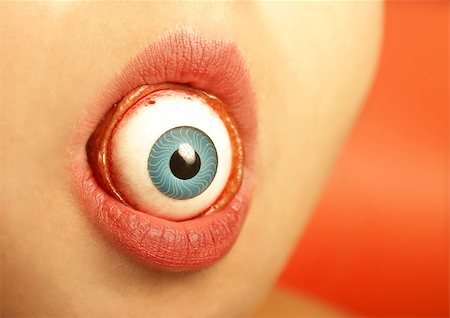 A sexy womans lips swallows an eyeball. Stock Photo - Budget Royalty-Free & Subscription, Code: 400-07660063