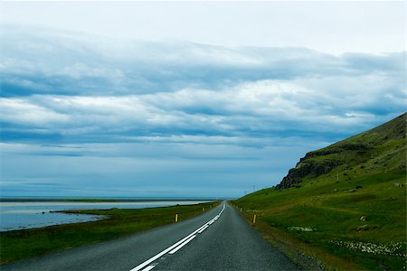 simsearch:400-08556910,k - Road against mountain background, Iceland, cloudy summer weather Stock Photo - Budget Royalty-Free & Subscription, Code: 400-07660153