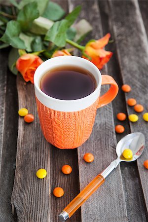 Cup of fresh black tea and colorful candies on the wooden table Stock Photo - Budget Royalty-Free & Subscription, Code: 400-07660388