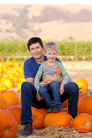 family of two at pumpkin patch Stock Photo - Budget Royalty-Free & Subscription, Code: 400-07660617