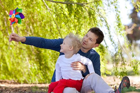 simsearch:400-04221909,k - family of two enjoying time together outdoors and having fun with pinwheel Stock Photo - Budget Royalty-Free & Subscription, Code: 400-07660618
