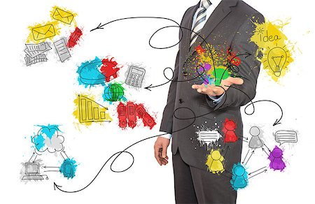 Standing businessman in suit and colored business sketches Stock Photo - Budget Royalty-Free & Subscription, Code: 400-07660694
