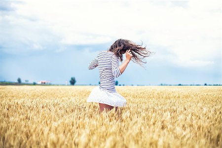 picture of people dancing for harvest - The beautiful girl is on a wheaten field Stock Photo - Budget Royalty-Free & Subscription, Code: 400-07661653