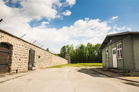 racism - mauthausen,Austria-:wall and the prisoners' barracks seen from inside the concentration camp during a sunny day Stock Photo - Budget Royalty-Free & Subscription, Code: 400-07661755