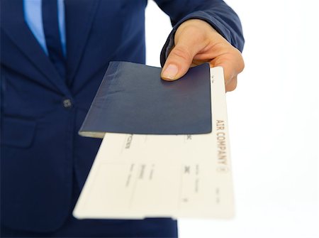 Closeup on business woman giving passport with ticket Stock Photo - Budget Royalty-Free & Subscription, Code: 400-07662435