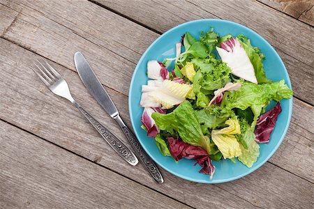 simsearch:400-06485512,k - Fresh healthy salad and silverware on wooden table background Stock Photo - Budget Royalty-Free & Subscription, Code: 400-07662574