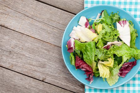 simsearch:400-06485512,k - Fresh healthy salad on wooden table with copy space Stock Photo - Budget Royalty-Free & Subscription, Code: 400-07662576