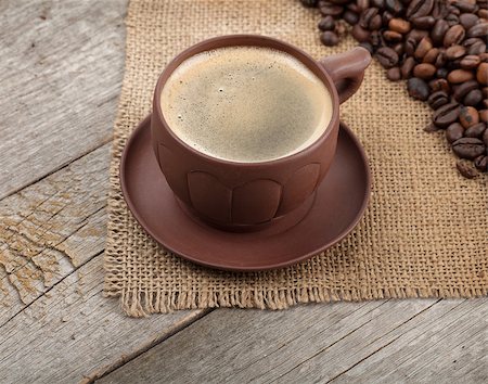 Coffee cup and beans on wooden table background Stock Photo - Budget Royalty-Free & Subscription, Code: 400-07662639