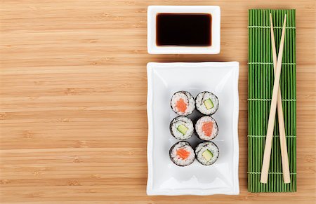 simsearch:400-08072780,k - Sushi set, chopsticks and soy sauce over bamboo table with copy space Stockbilder - Microstock & Abonnement, Bildnummer: 400-07662718