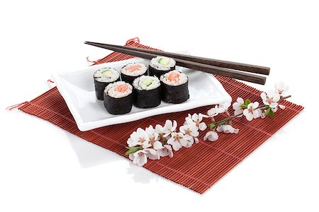 simsearch:400-08072780,k - Sushi maki set with salmon and cucumber and sakura branch. Isolated on white background Stockbilder - Microstock & Abonnement, Bildnummer: 400-07662721