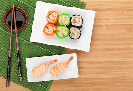 Sushi maki and shrimp sushi on bamboo table with copy space Stock Photo - Budget Royalty-Free & Subscription, Code: 400-07662744