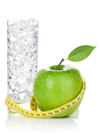 Fresh green apple with yellow measuring tape and glass of water. Healthy food. Isolated on white background Photographie de stock - Aubaine LD & Abonnement, Code: 400-07662747