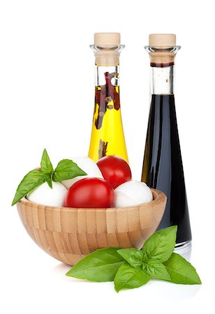 simsearch:400-07172265,k - Mozzarella cheese with cherry tomatoes, basil and olive oil with vinegar. Isolated on white background Foto de stock - Royalty-Free Super Valor e Assinatura, Número: 400-07662766