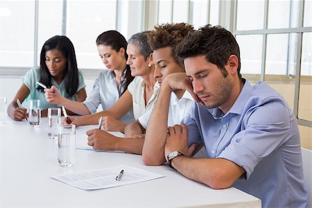 Casual businessman falling asleep during meeting in the office Stock Photo - Budget Royalty-Free & Subscription, Code: 400-07663244