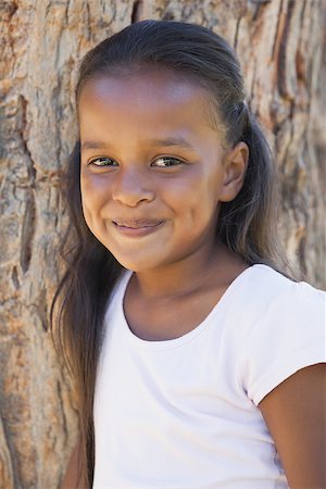 simsearch:400-06890095,k - Little girl by large tree smiling at camera on a sunny day Stock Photo - Budget Royalty-Free & Subscription, Code: 400-07663648