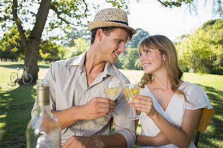 Cute couple drinking white wine together outside on a sunny day Stock Photo - Budget Royalty-Free & Subscription, Code: 400-07663853