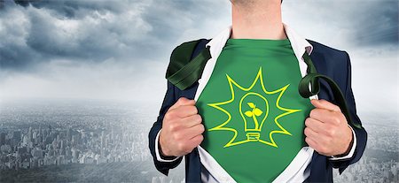 simsearch:400-07664375,k - Businessman opening shirt in superhero style against cityscape on a wall Foto de stock - Royalty-Free Super Valor e Assinatura, Número: 400-07663986