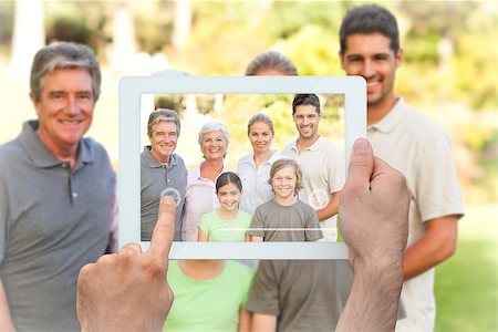 family with tablet in the park - Hand holding tablet pc showing family in the park Stock Photo - Budget Royalty-Free & Subscription, Code: 400-07663999