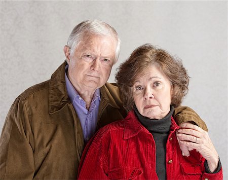 elderly couple concern - Serious European man and woman holding hands Stock Photo - Budget Royalty-Free & Subscription, Code: 400-07675216