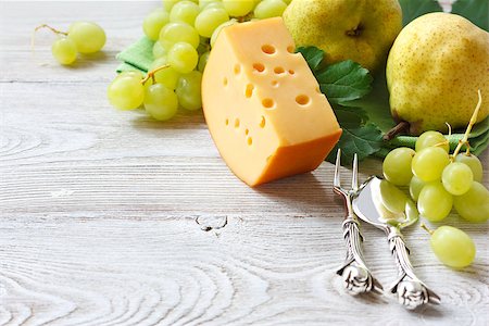 Delicious cheese and fruits on a wooden board. Food ingredients background. Selective focus. Stock Photo - Budget Royalty-Free & Subscription, Code: 400-07675904